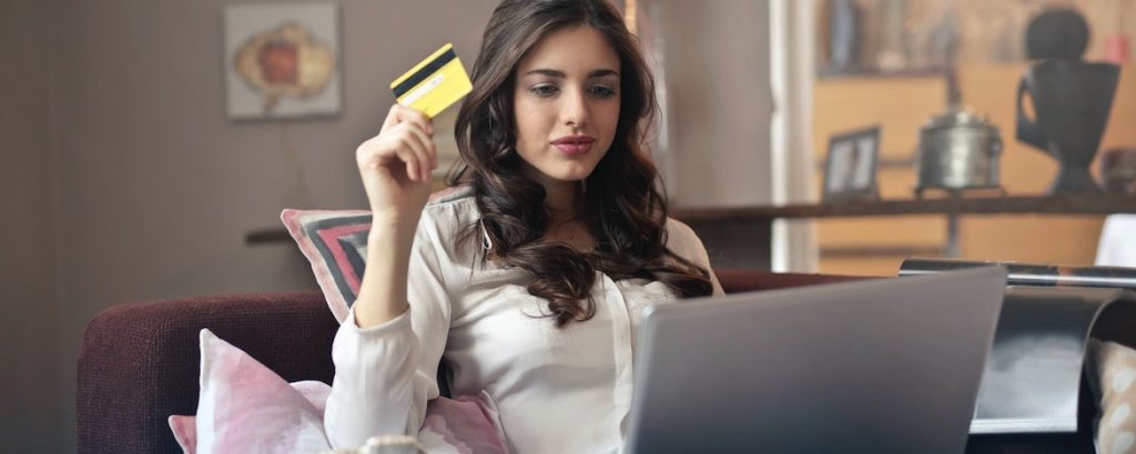 woman at laptop with credit card